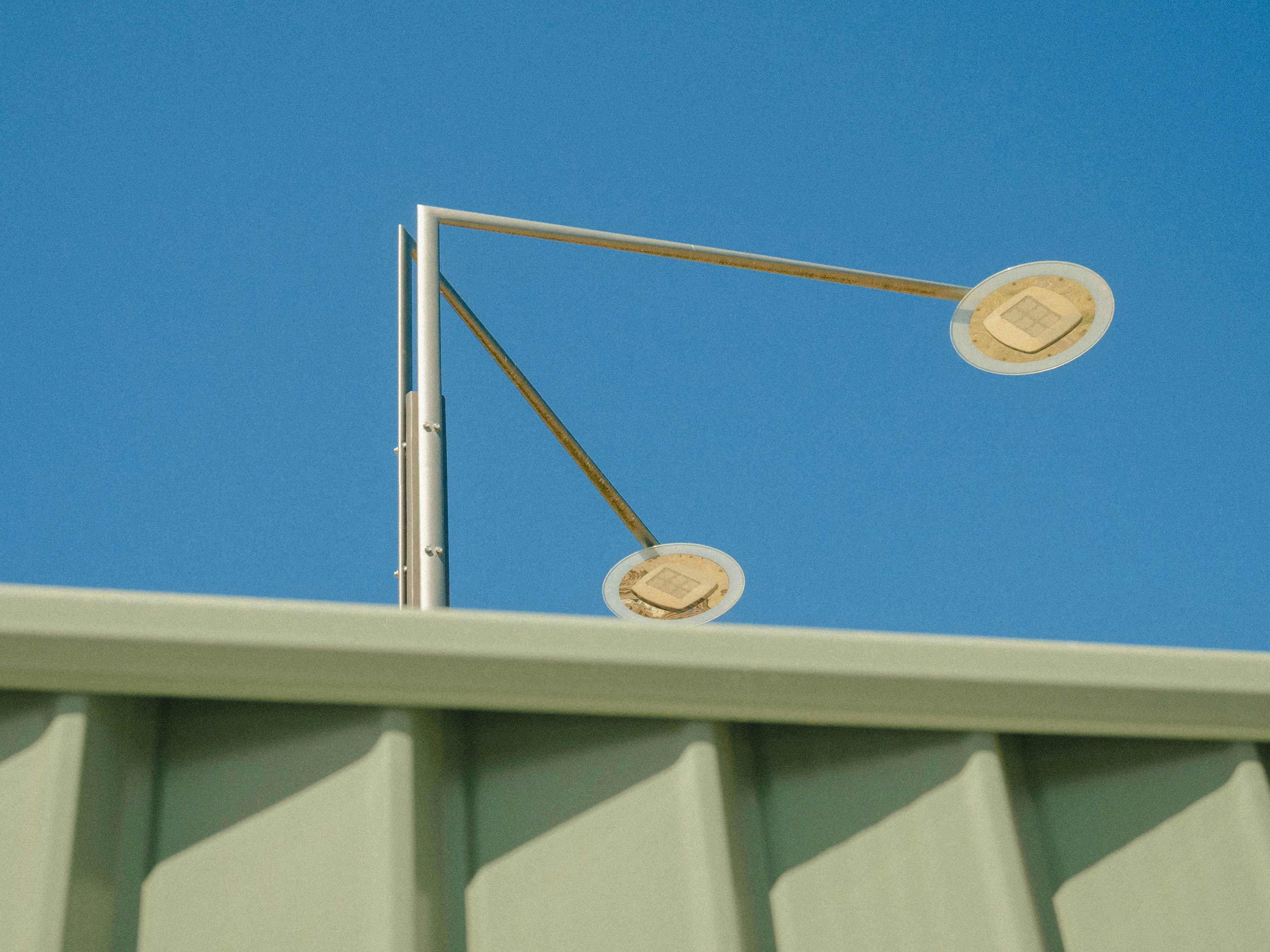 a street light sitting on top of a metal pole